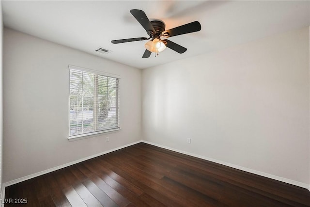 empty room featuring dark hardwood / wood-style floors and ceiling fan