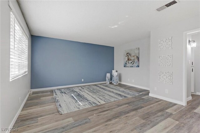 spare room featuring light hardwood / wood-style floors