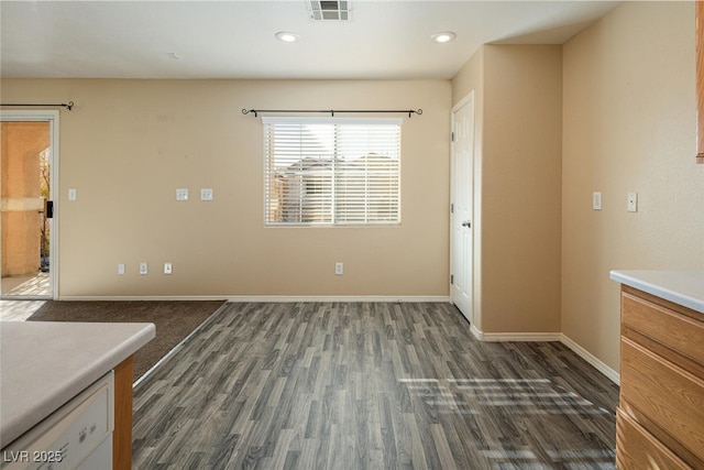 unfurnished dining area with dark hardwood / wood-style floors