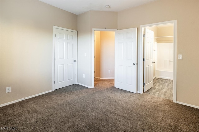 unfurnished bedroom with light colored carpet