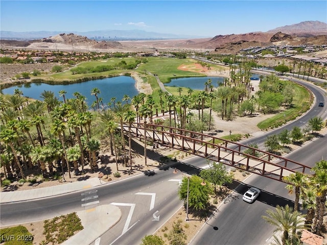 aerial view featuring a water and mountain view