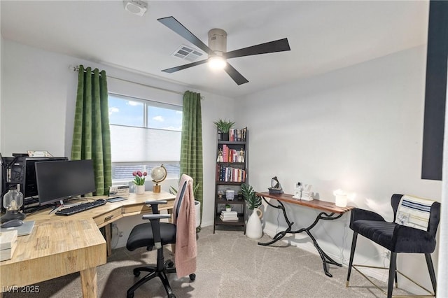 carpeted office with ceiling fan