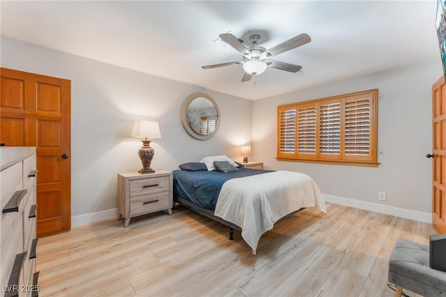 bedroom featuring ceiling fan and light hardwood / wood-style flooring