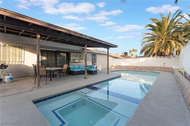 view of pool featuring outdoor lounge area, an in ground hot tub, and a patio