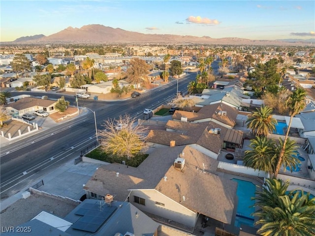 birds eye view of property featuring a mountain view