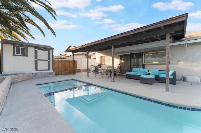 view of pool featuring an outdoor living space, a storage unit, and a patio area