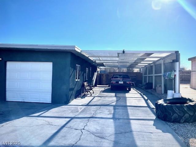 view of side of home featuring a carport