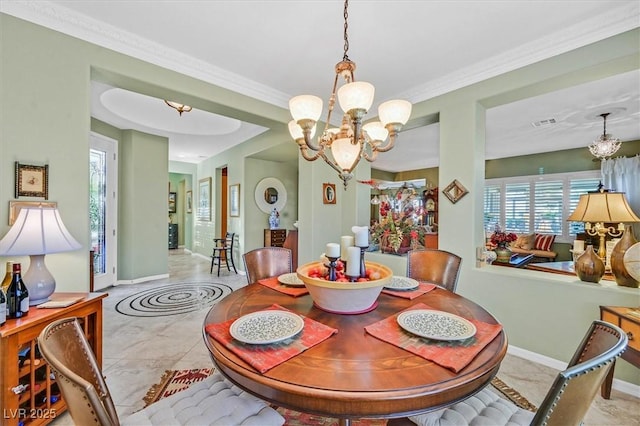 dining area featuring plenty of natural light, light tile patterned flooring, a chandelier, and ornamental molding