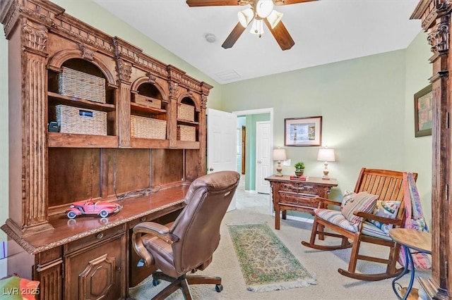 office space featuring ceiling fan and light carpet