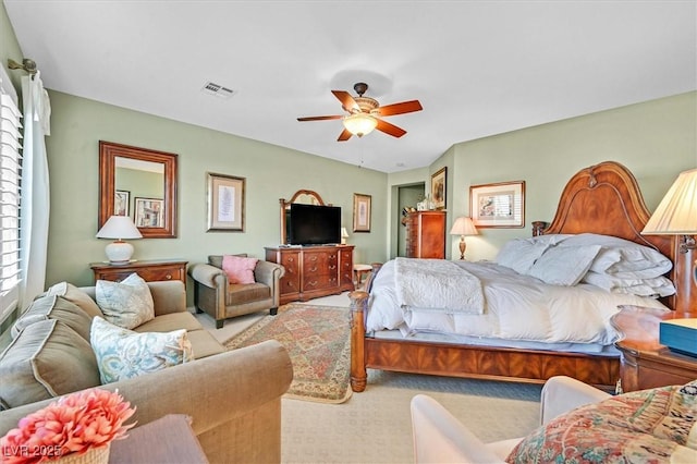 carpeted bedroom featuring ceiling fan