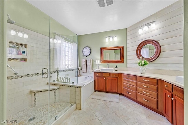 bathroom with tile patterned flooring, vanity, and independent shower and bath