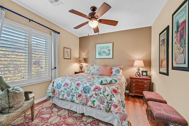 bedroom featuring ceiling fan and light hardwood / wood-style flooring