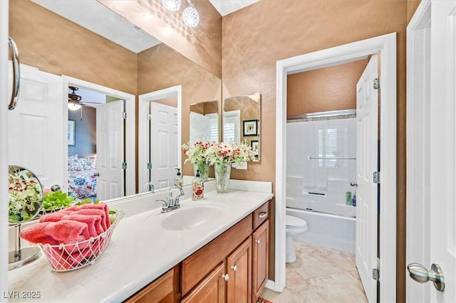 full bathroom with ceiling fan, tile patterned floors, toilet, shower / bath combination with glass door, and vanity