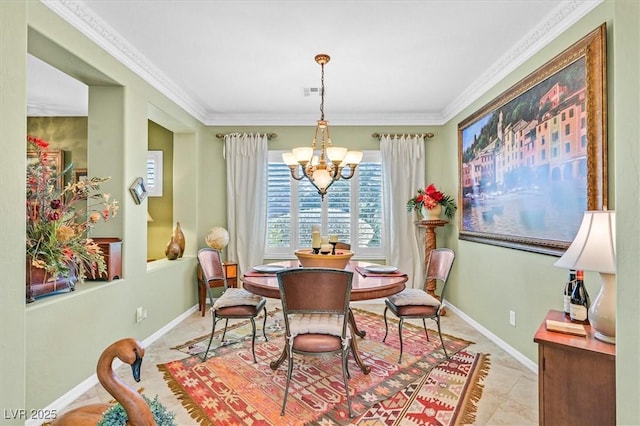 dining room with crown molding, light tile patterned floors, and a chandelier