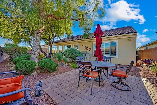 rear view of property featuring a patio