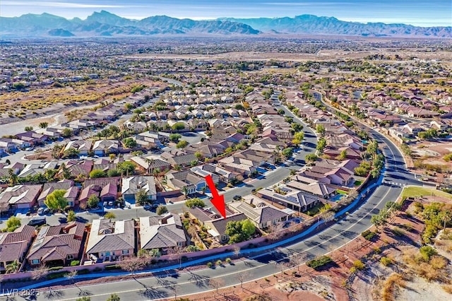 birds eye view of property with a mountain view