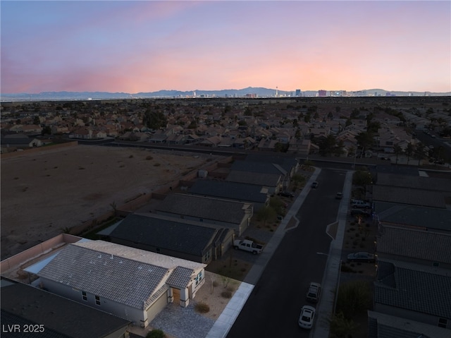 aerial view at dusk with a mountain view