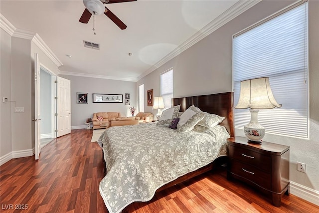 bedroom featuring hardwood / wood-style flooring, ornamental molding, and ceiling fan