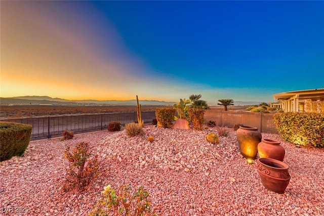 yard at dusk with a mountain view