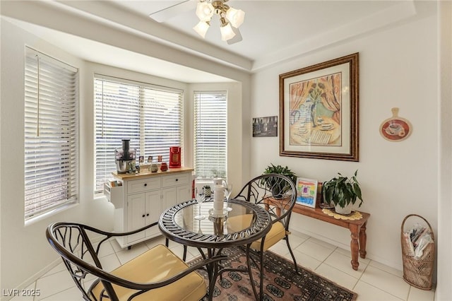 interior space featuring ceiling fan and light tile patterned floors