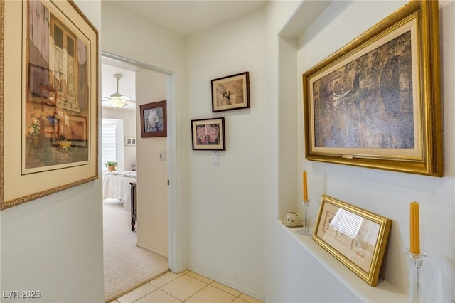 hallway featuring light carpet