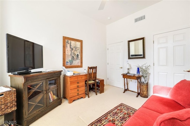 carpeted office featuring ceiling fan