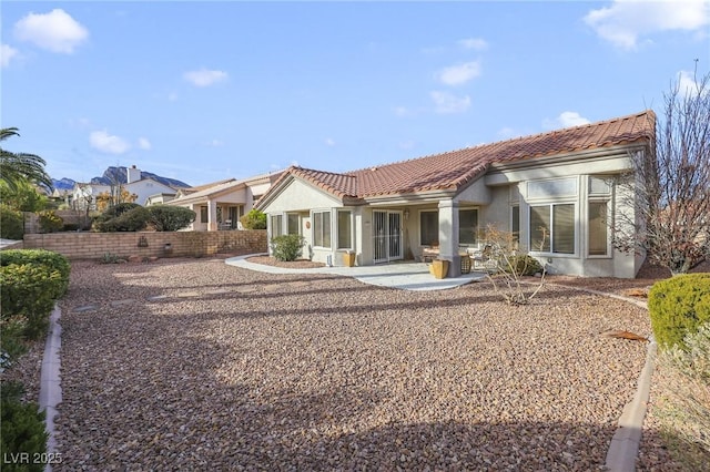 rear view of property with a patio