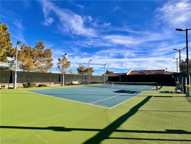 view of sport court featuring basketball hoop