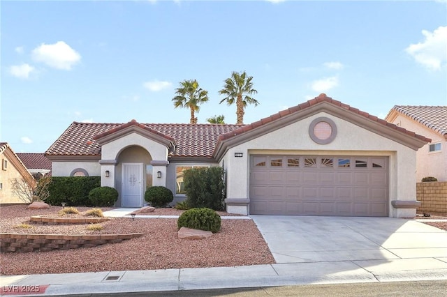 mediterranean / spanish-style home featuring a garage