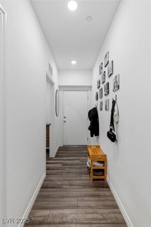 hallway featuring dark hardwood / wood-style flooring