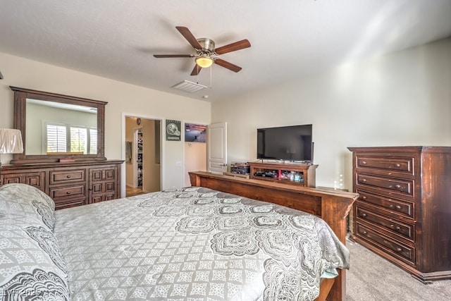 bedroom with light carpet and ceiling fan