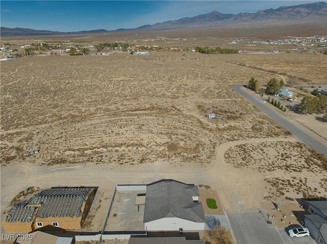 drone / aerial view featuring a mountain view