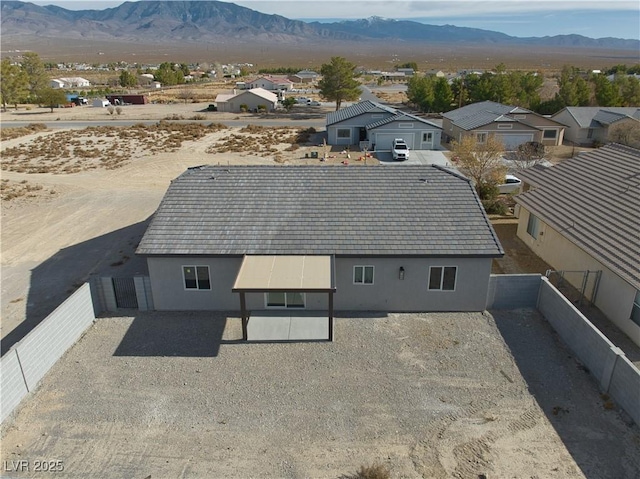 birds eye view of property featuring a mountain view