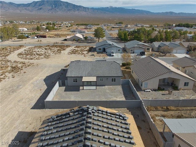 birds eye view of property featuring a mountain view