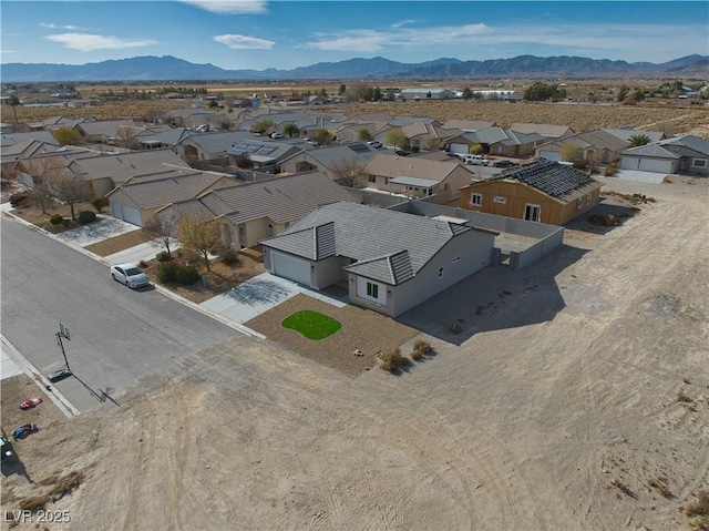 birds eye view of property featuring a mountain view