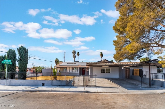 ranch-style house featuring solar panels