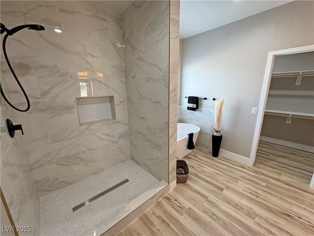 bathroom featuring hardwood / wood-style floors and independent shower and bath