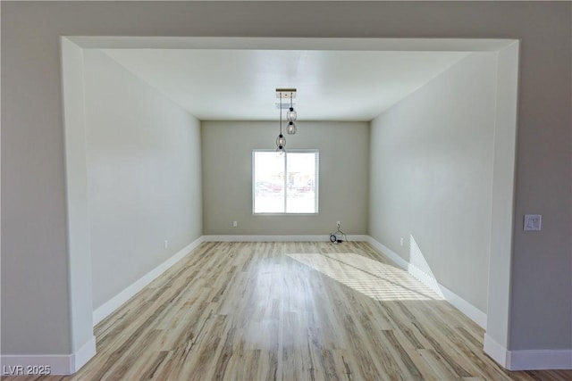 unfurnished room with light hardwood / wood-style flooring