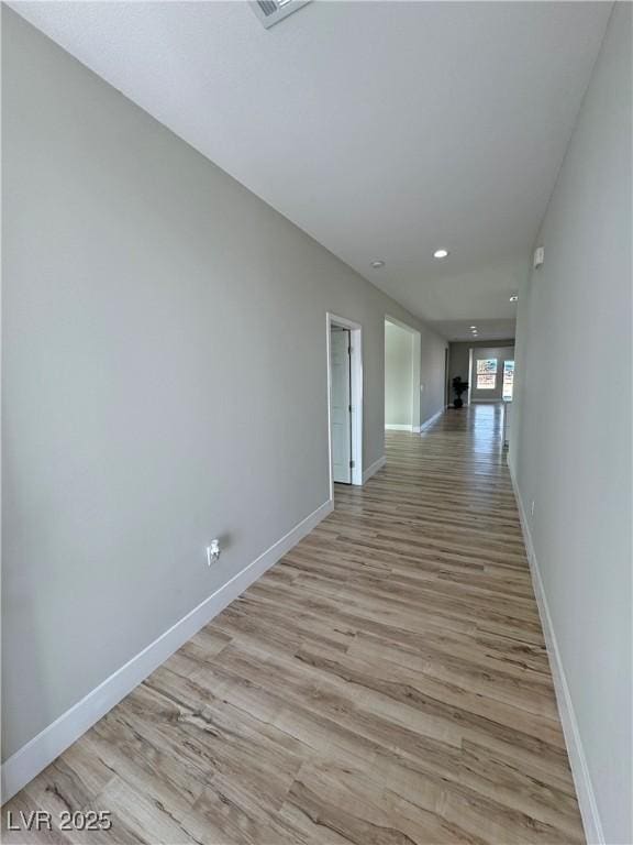 corridor featuring light hardwood / wood-style floors