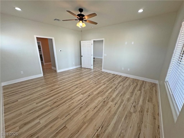 unfurnished bedroom featuring light hardwood / wood-style flooring and ceiling fan