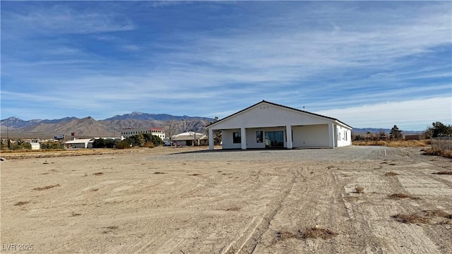 exterior space featuring a mountain view