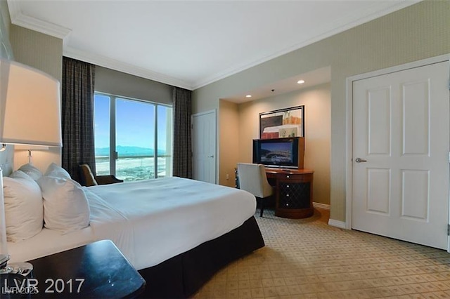 carpeted bedroom with ornamental molding