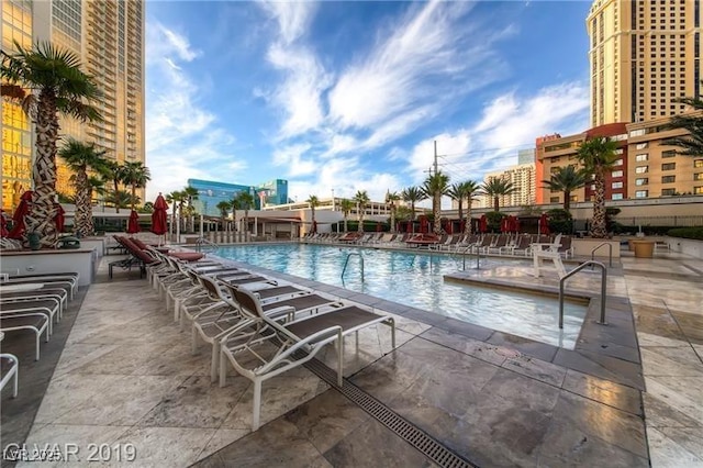 view of swimming pool featuring a patio