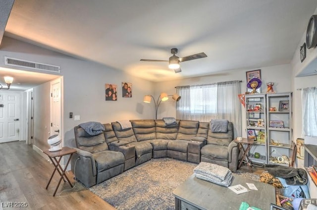 living room with ceiling fan and hardwood / wood-style floors