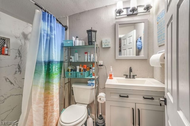 bathroom with vanity, a textured ceiling, a shower with shower curtain, and toilet