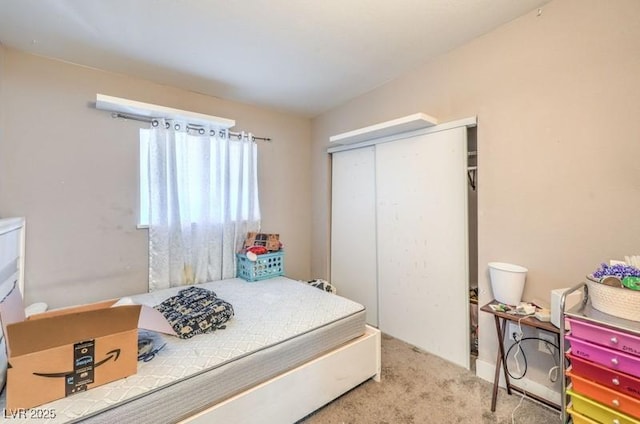 carpeted bedroom with a closet