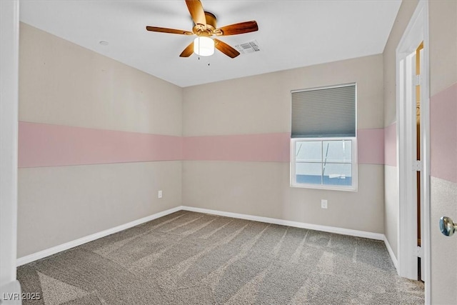 empty room featuring carpet and ceiling fan