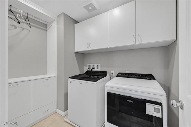 laundry area with cabinets and independent washer and dryer