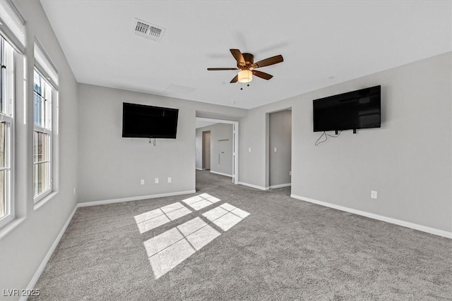 unfurnished living room featuring carpet flooring and ceiling fan