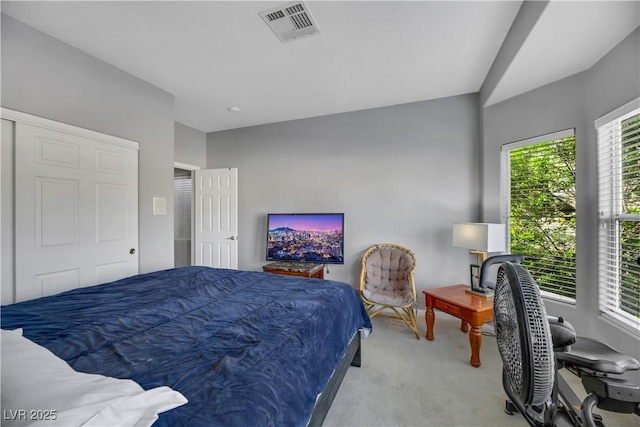 bedroom with light colored carpet